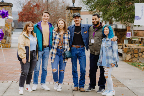 a group of people posing for a photo