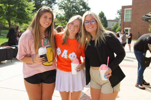 a group of women posing for a photo