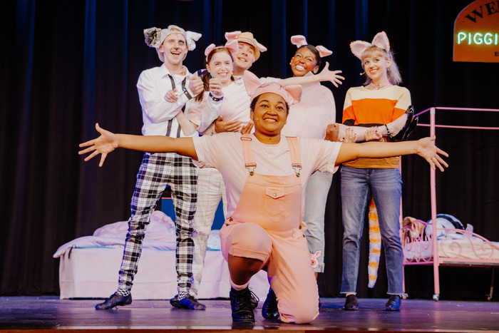 a group of people in a stage performance