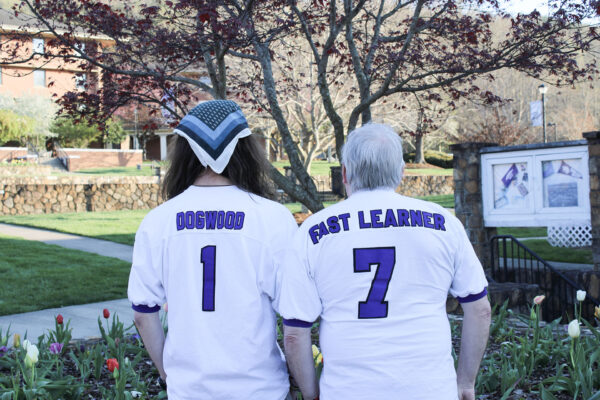 a couple of people wearing sports uniforms