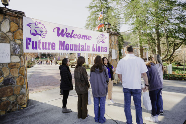 a group of people holding a banner