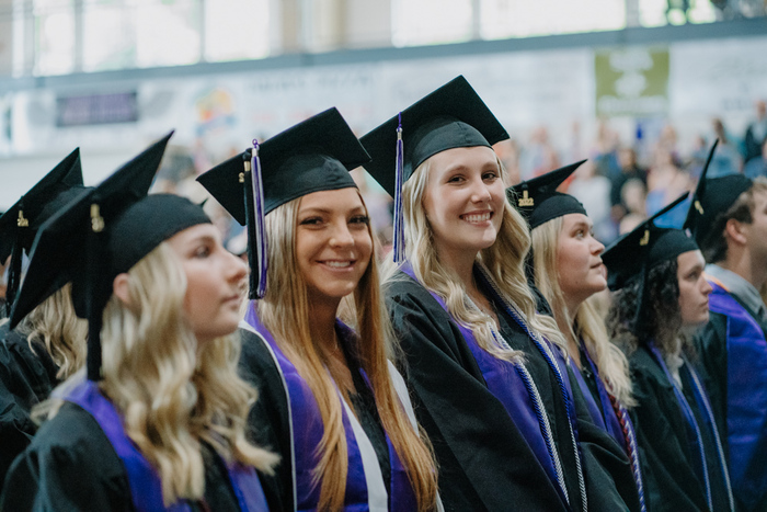 a group of people wearing graduation caps and gowns