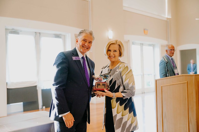 a man and a woman holding award