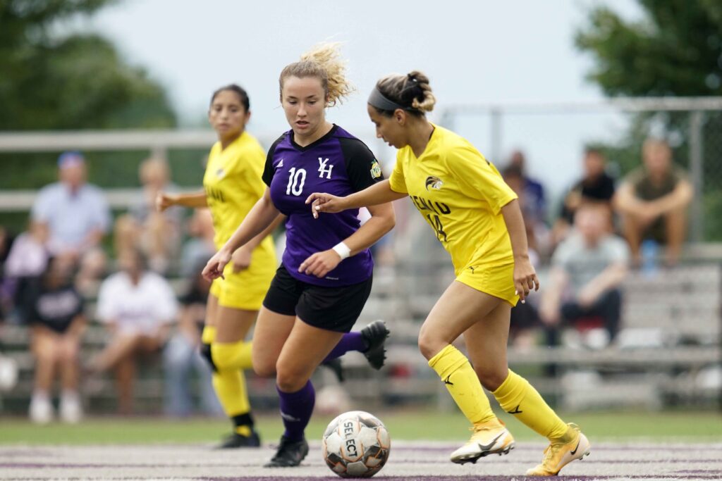 a group of women playing soccer