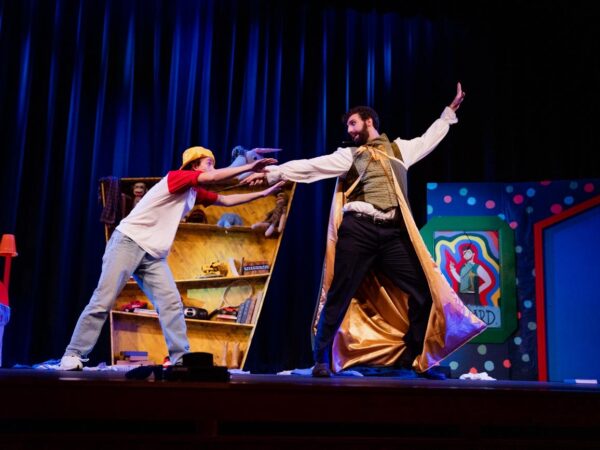 a man and woman performing on a stage