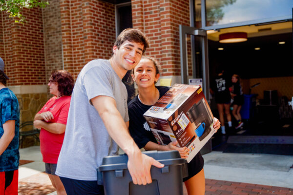 a man and a woman moving in