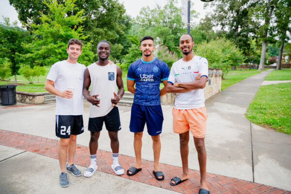 a group of men posing for a picture