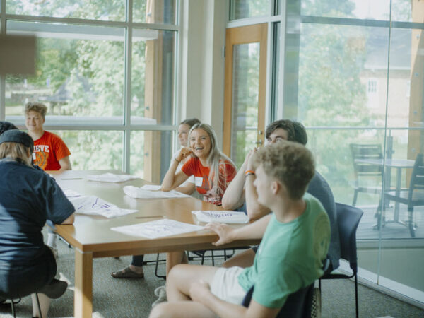 a group of people sitting at a table