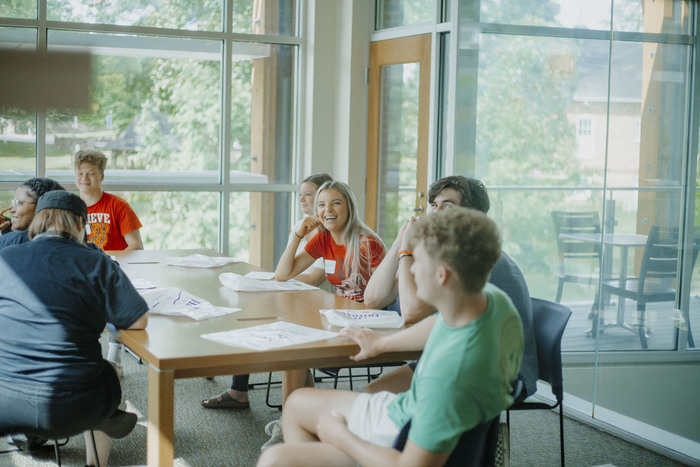 a group of people sitting at a table