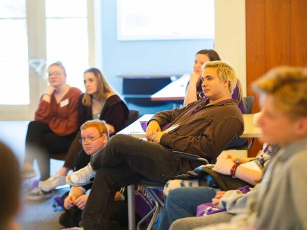 a group of people sitting in a room