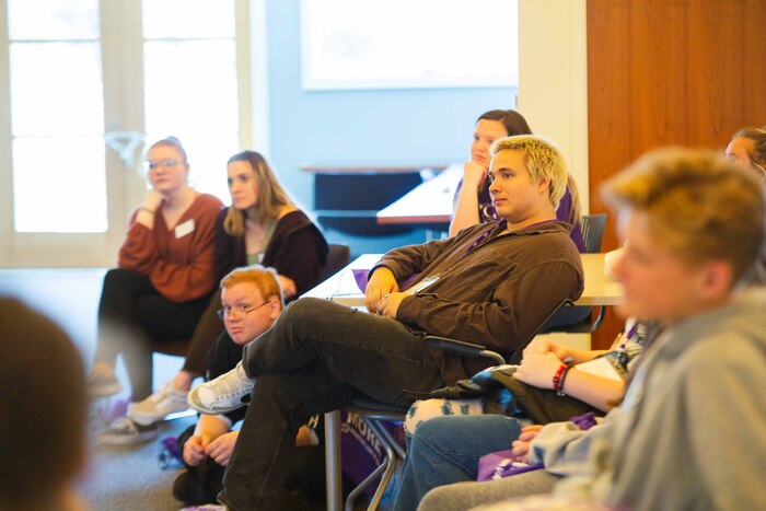 a group of people sitting in a room