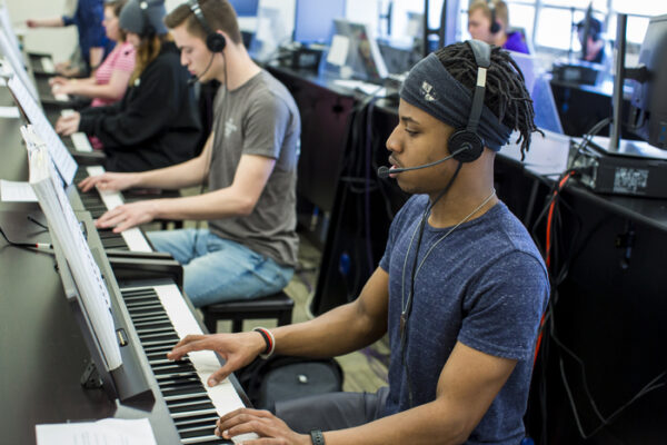 a man playing a piano