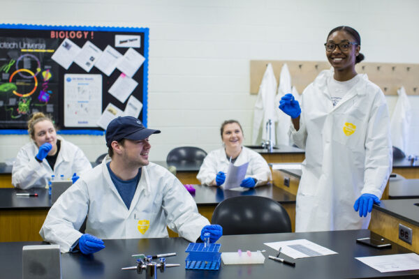 a few people in lab coats