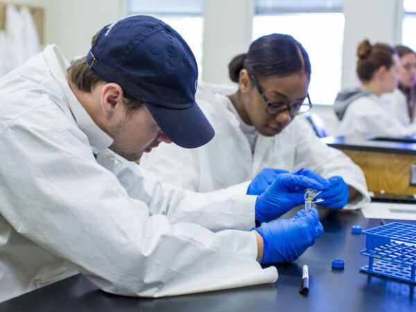 a couple of people in lab coats