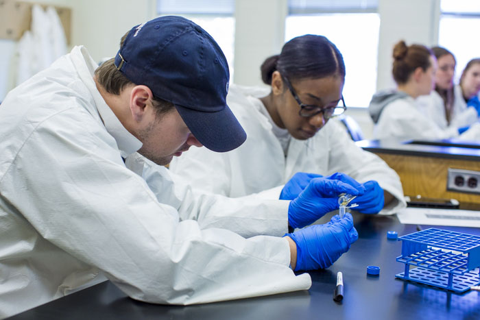 a couple of people in lab coats