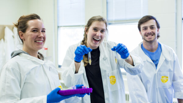 a group of people in lab coats