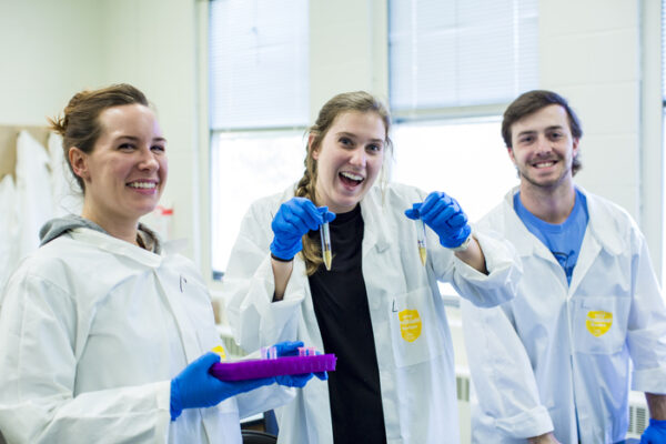 a group of people in lab coats