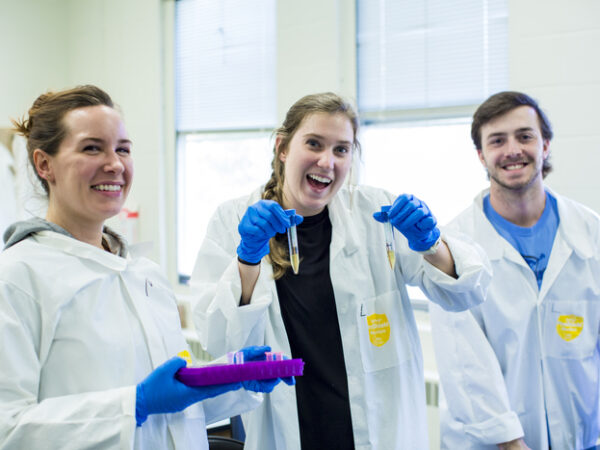 a group of people in lab coats