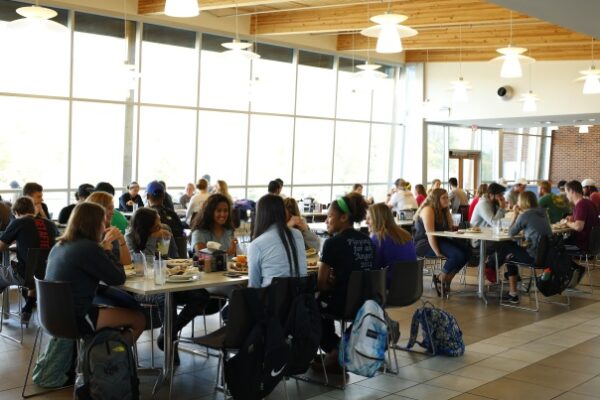 a group of people dining at tables