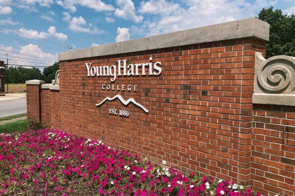 Young Harris College brick wall with flowers