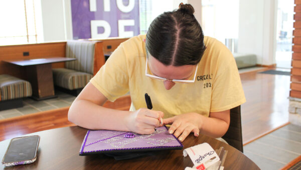 a person writing on a book