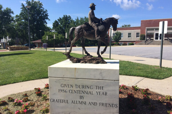 a statue of a person riding a horse