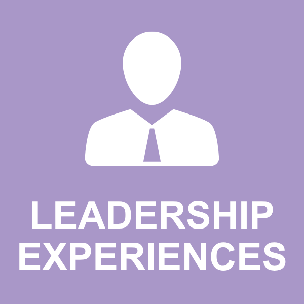 a large brick building with a steeple and a cross on top