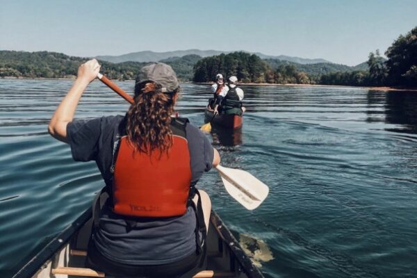 a group of people paddling on boats