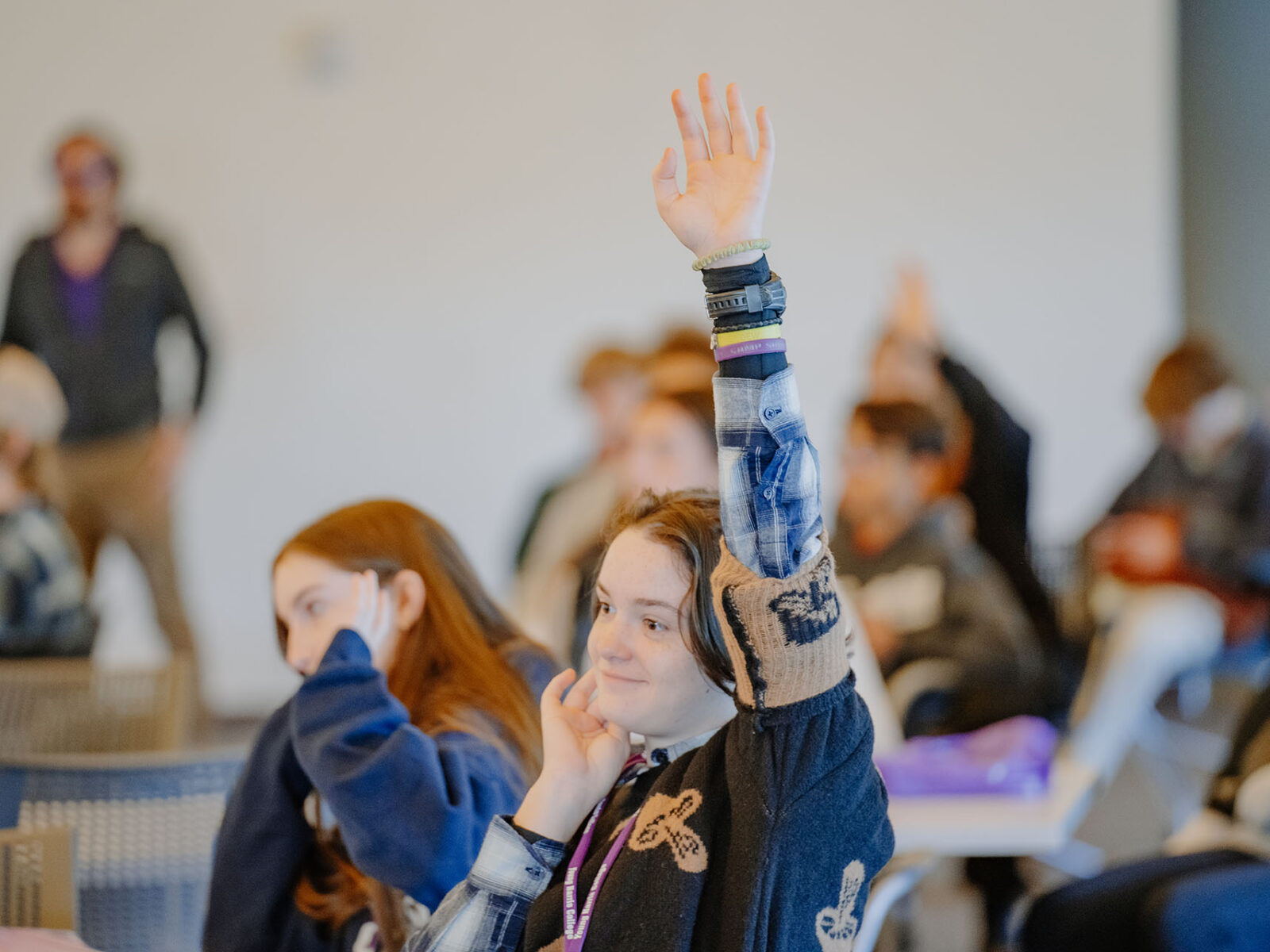 a group of people raising their hands