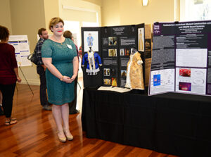 Undergraduate Research Day Student with presentation board