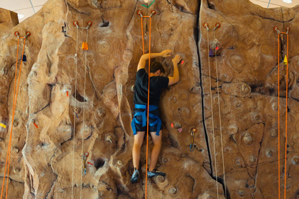 Male Young Harris College student on a climbing wall
