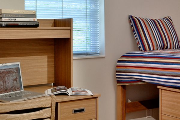 a bedroom with a bed and a book